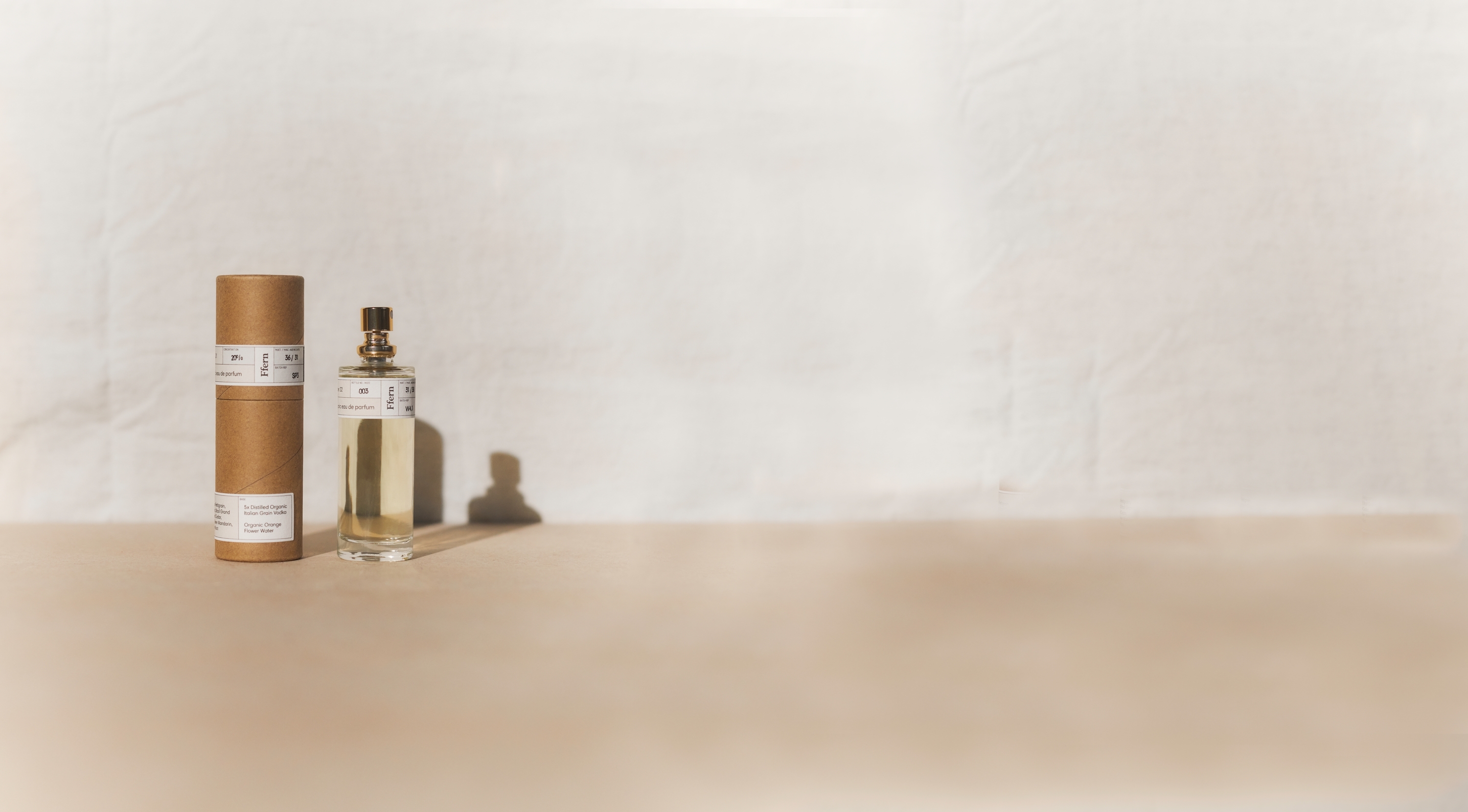 Ffern perfume bottle alongside ffern sustainable perfume tube
